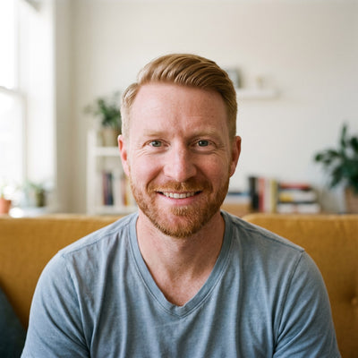 Man smiling in a living room in the morning