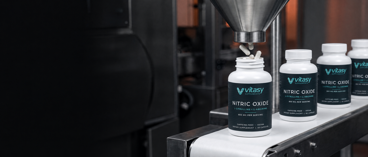 Vitasy Nitric Oxide capsule bottles being filled on a production line