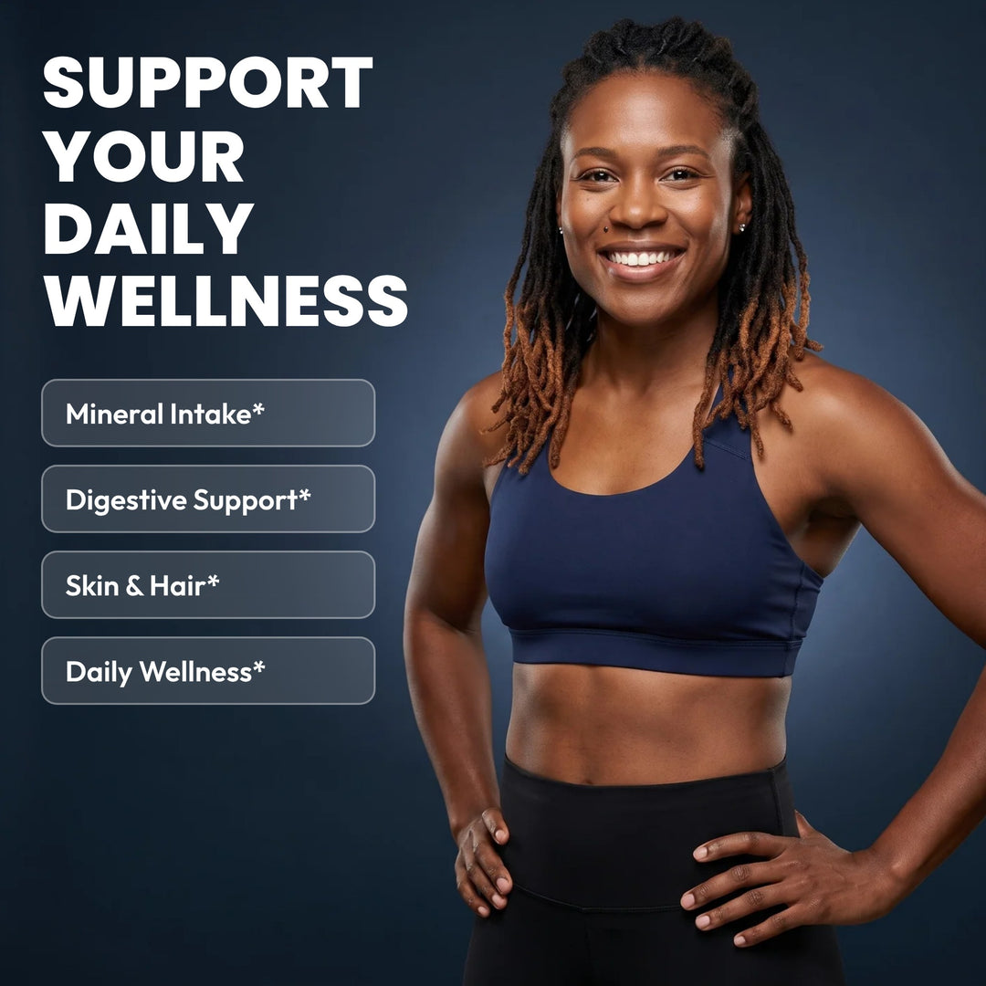 Smiling woman in navy activewear with the text Support Your Daily Wellness: Mineral Intake, Digestive Support, Skin & Hair, Daily Wellness